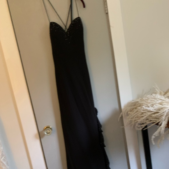 Black, backless, beautiful evening gown. Dry cleaned and no flaws. Size 10 - Picture 3 of 4